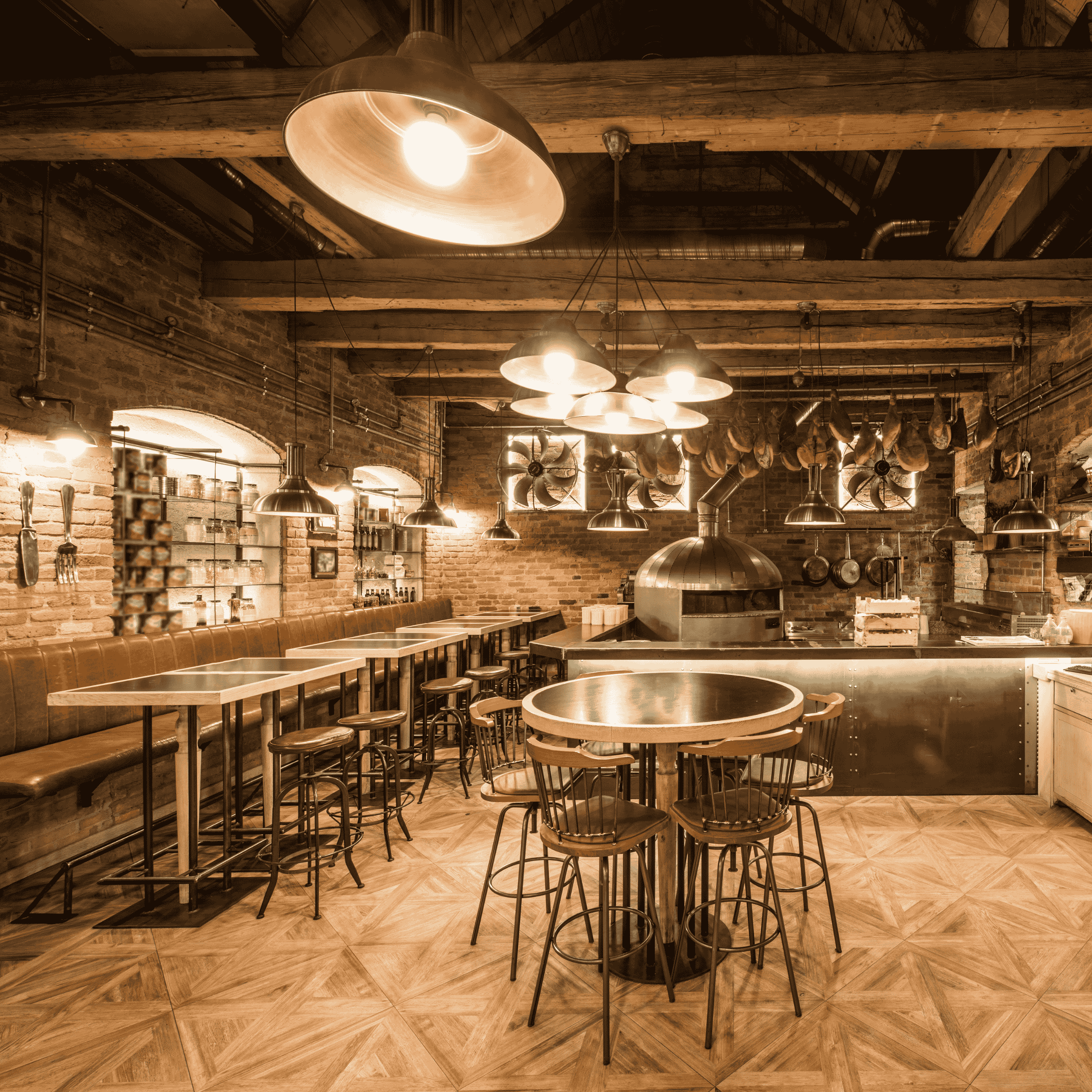 A professional chef working in a modern commercial kitchen filled with stainless steel equipment financed through a restaurant loan.